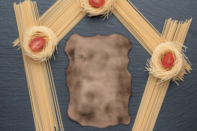 Pasta on a dark grey stone background