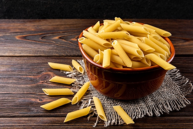 Pasta on dark wooden background