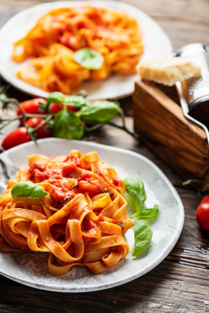 Pasta fettuccine with tomato and basil