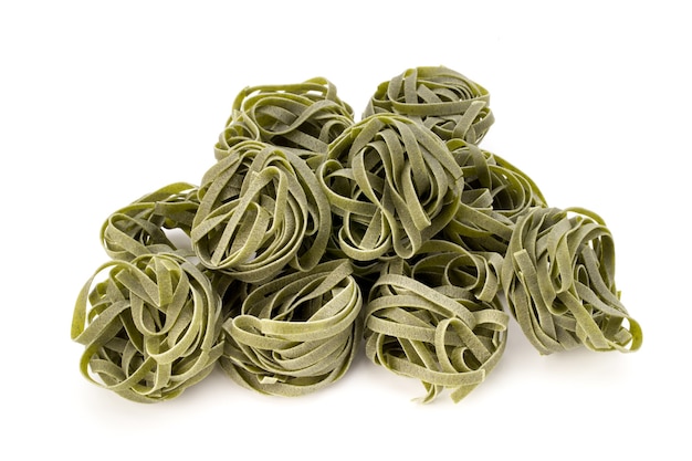 Pasta; food; spinach; cooking; cuisine; curve; dried; dry; eating; egg; fettuccine; flour; gourmet; green; ingredient; italian; nest; raw; vegetarian; wheat;