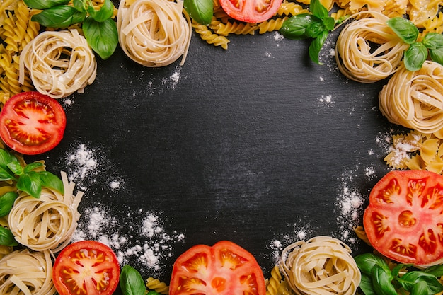 Pasta and fresh vegetables scattered in flour