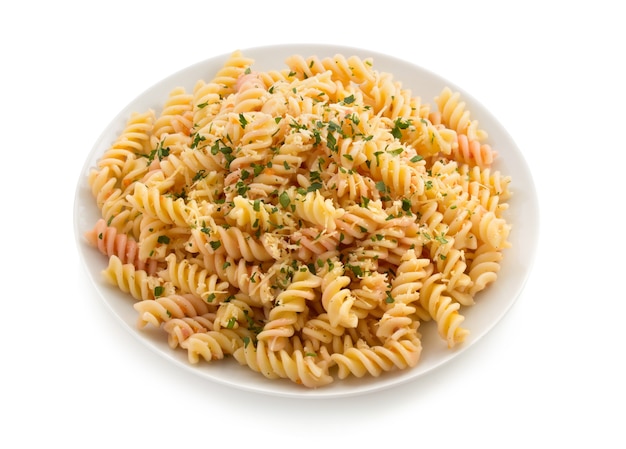 Pasta fusilli in plate isolated on white