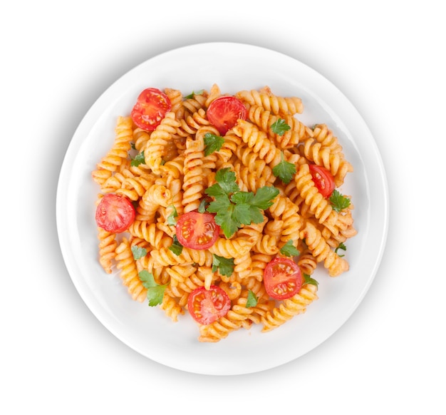 Pasta fusilli with bolognese tomato beef sauce on the kitchen table