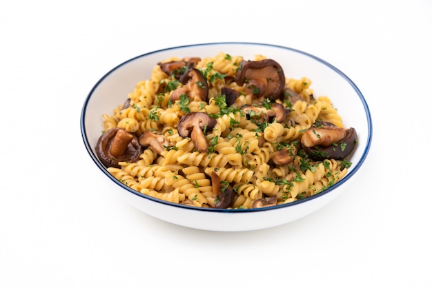 Pasta fusilli with mushroom in herb sauce