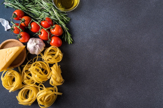 Pasta and Ingredients for cooking on dark