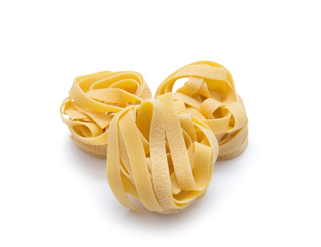 Pasta nest uncooked tagliatelle isolated