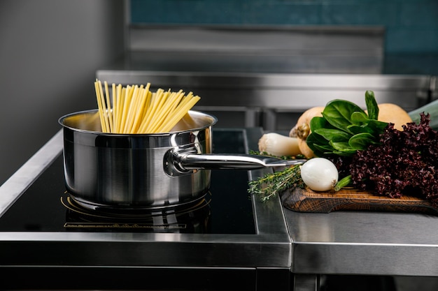 Pasta in a pan in the kitchen of a restaurant