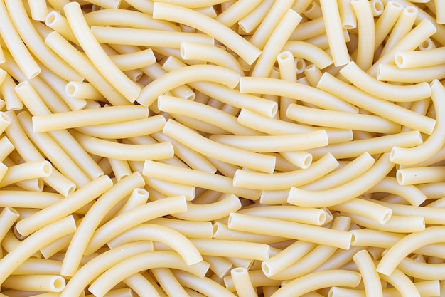 Pasta pasta textuur Italiaanse maccheroni sneltoets noedels in de vorm van smalle buisjes Ongekookte gedroogde durumtarwe griesmeel pasta