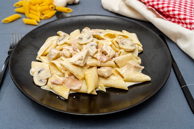 Pasta Penne with jam, Chicken and Mushroom under Parmesan Cheese