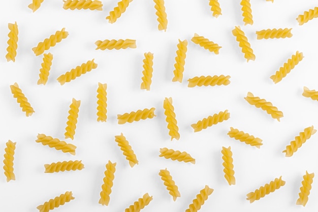 Pasta products in the form of a spiral texture on a white background