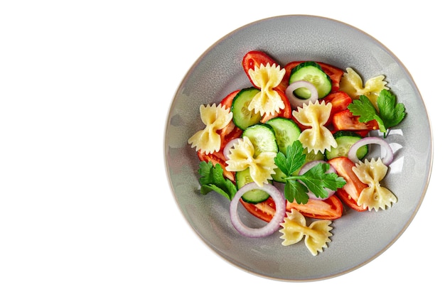 Pasta salad no meat tomato cucumber farfalle healthy meal diet snack on the table copy space