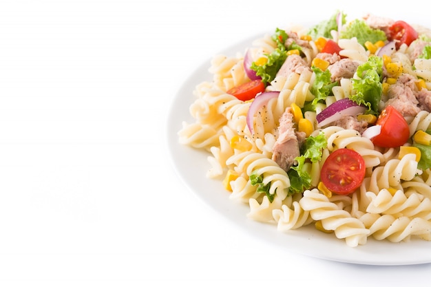 Pasta salad with vegetables on white