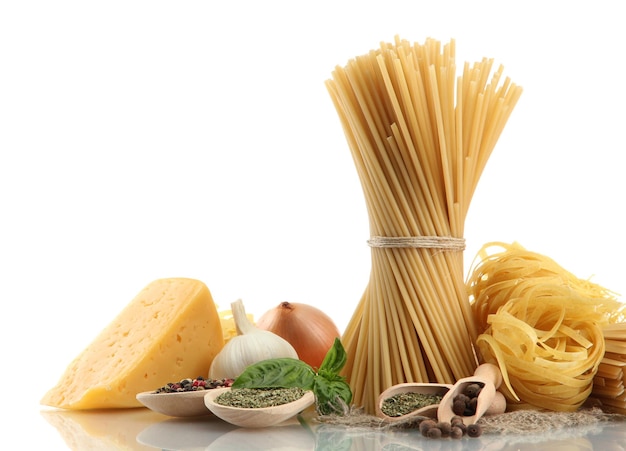 Pasta spaghetti vegetables and spices isolated on white