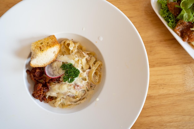 Pasta Spaghetti with black truffle white mushroom Cream Sauce and ricotta cheese