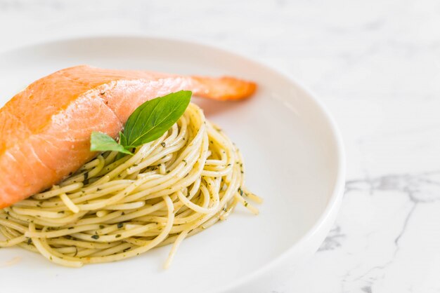 pasta spaghetti with pesto green and salmon