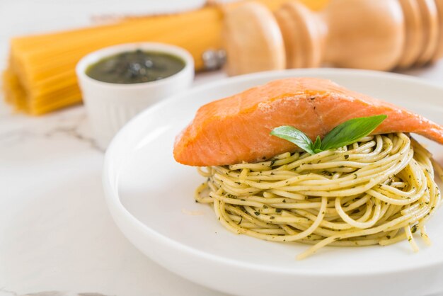 pasta spaghetti with pesto green and salmon