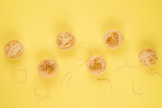 Pasta. Top view.On the yellow background.