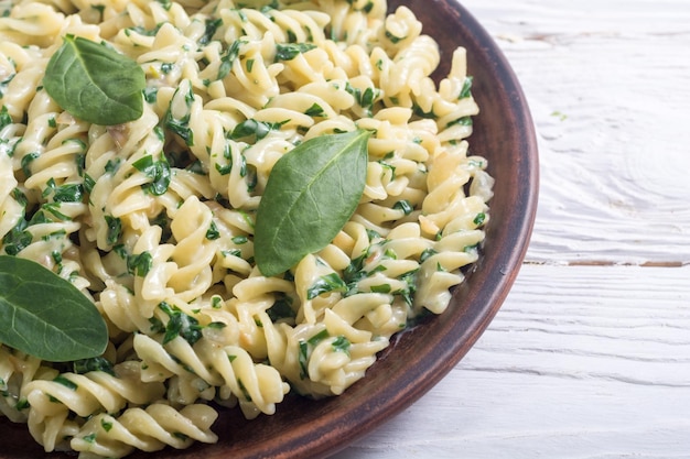 Premium Photo | Pasta with baby spinach italian food background
