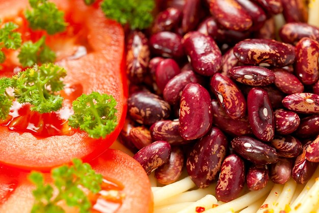 Pasta with baked beans and fresh tomatoes.