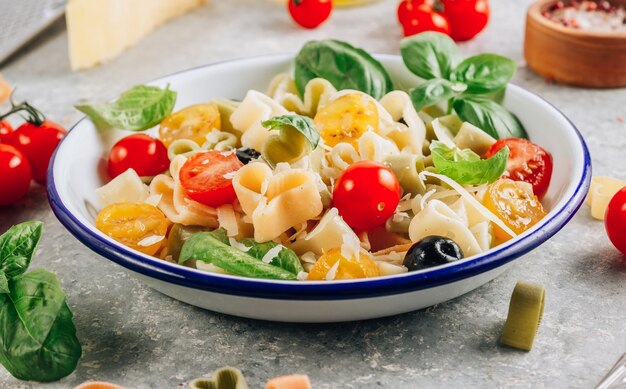 Pasta with basil leaves and parmesan