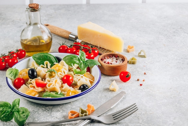 Pasta with basil leaves and parmesan