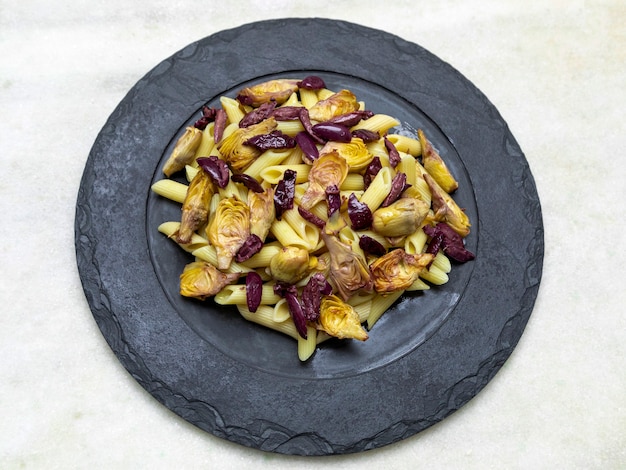 Pasta with black olives and artichoke hearts