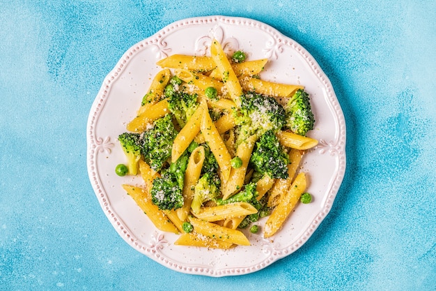 Pasta with broccoli, green peas, garlic and cheese