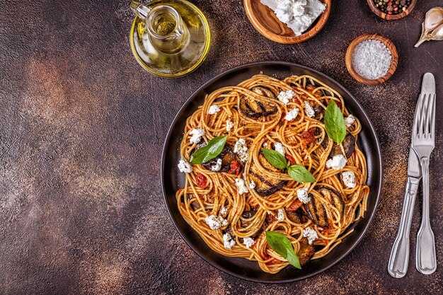 Pasta with eggplant, tomato, cheese, and basil