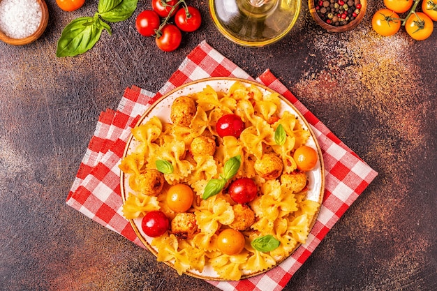 Photo pasta with meatballs and tomato sauce, top view, copy space.