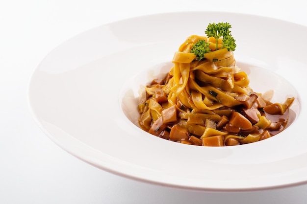 Pasta with mushrooms on white background