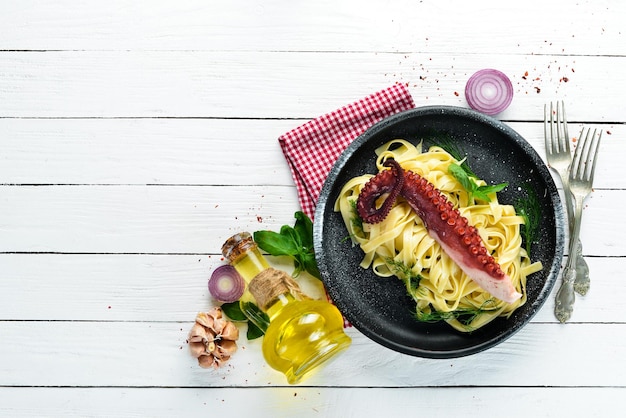Pasta with octopus on a stone plate Top view Free copy space