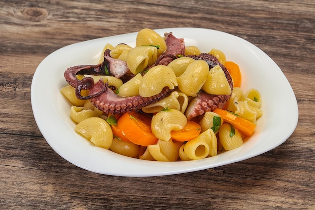 Pasta with octopus and yellow tomatoes