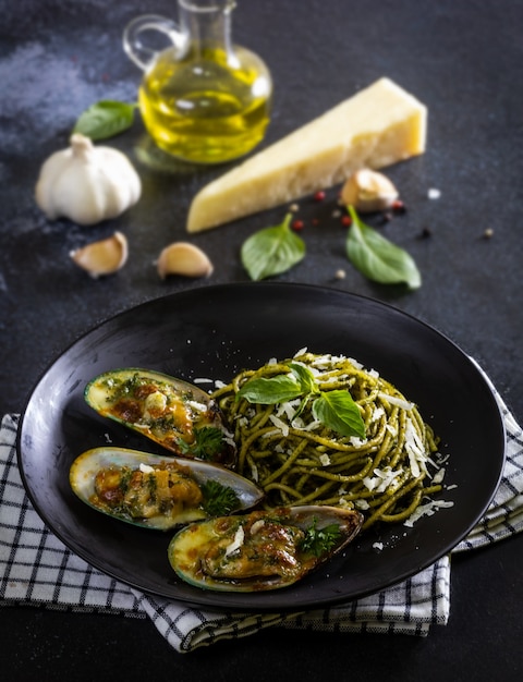 Pasta with Pesto Sauce and Baked Clams with Cheese