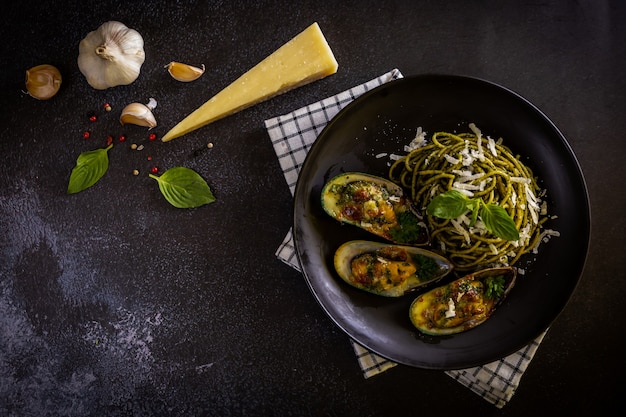 Pasta with Pesto Sauce and Baked Clams with Cheese