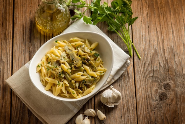 Pasta with sauteed artichoke garlic and olive oil