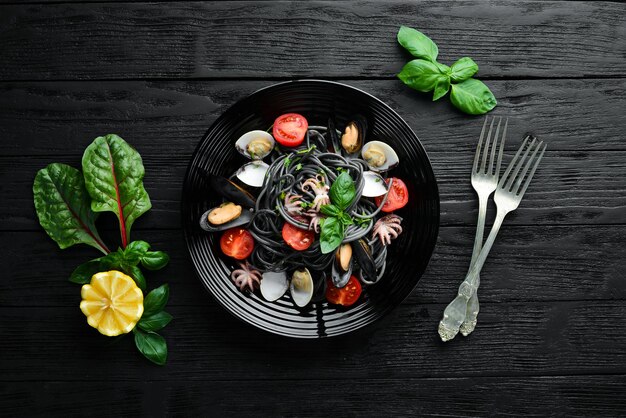Pasta with seafood Black paste Seafood Top view Free copy space