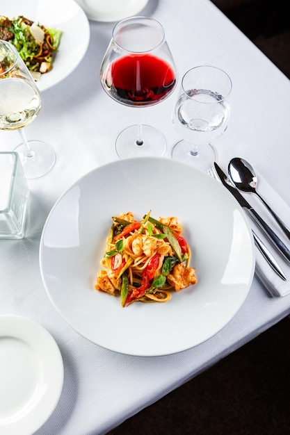 Pasta with shrimps green asparagus and peppers