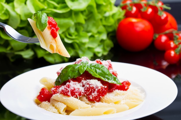 Pasta with tomato sauce and basil