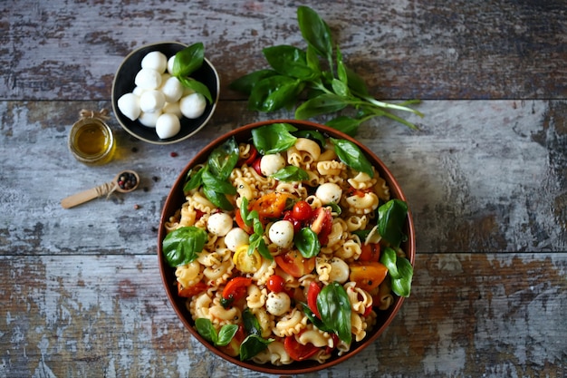 Pasta with tomatoes basil and mozzarella balls