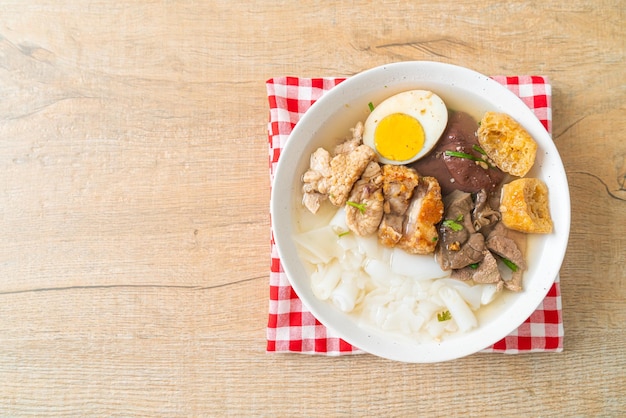 Paste of rice flour or boiled Chinese pasta square in clear soup