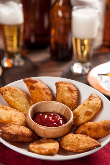 Pastel, a Brazilian snack, with a bar