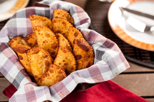 Pastel, a Brazilian snack, with a bar