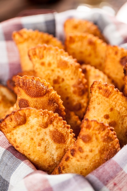 Pastel, a Brazilian snack, with a bar