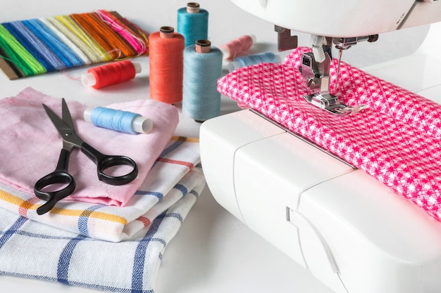 Pastel color background, Dressmaker and designer desk, Handcraft accessories, Threads roll,scissors 