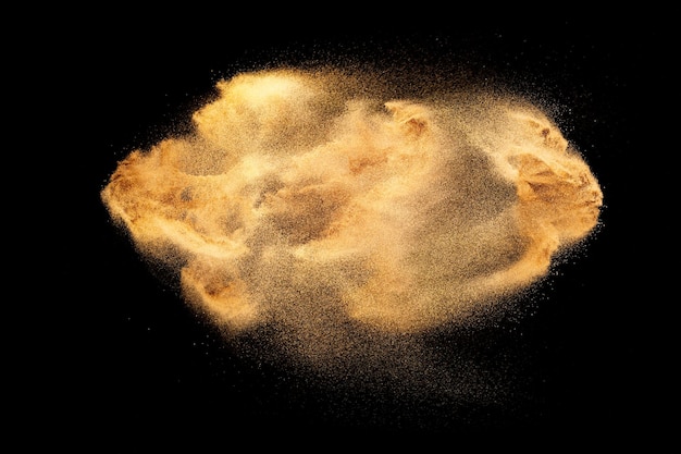 パステルカラーの粉塵粒子の飛散黒い背景にカラフルな粉の爆発