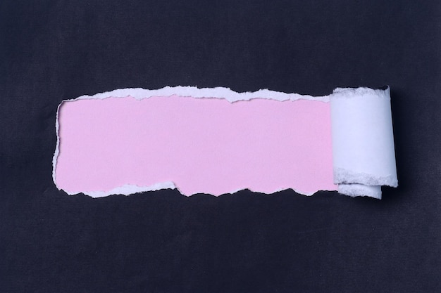 Pastel color torn paper with space for text. Black and pink color.