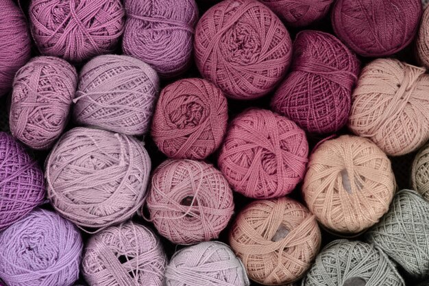 Pastel colored yarn balls, viewed from above.