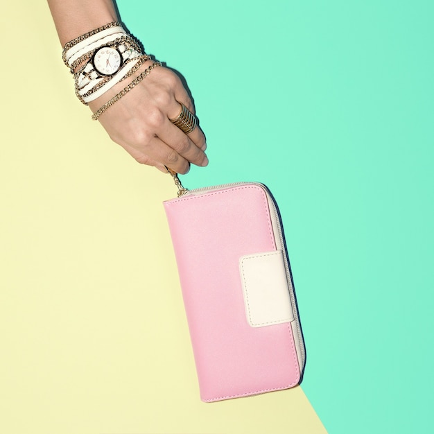 Photo pastel colors trend. fashion summer accessories. watches and ladies clutch.