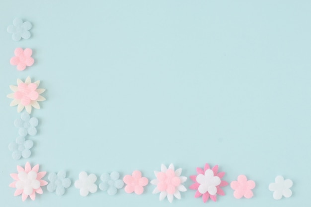 Pastel flower on blue color paper background