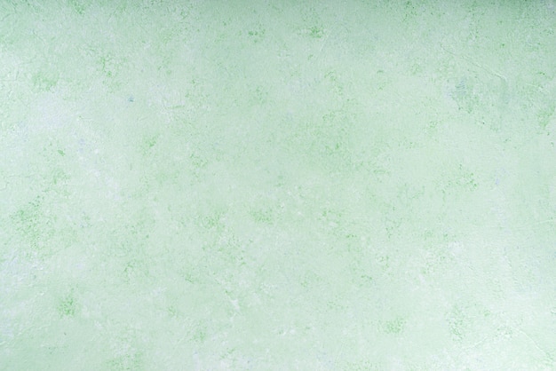 Pastel green concrete stone background top view, wall table surface